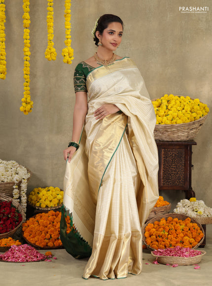 Cream-Green Pure kanchipuram silk saree with silver & gold zari woven stripes pattern and long zari woven border