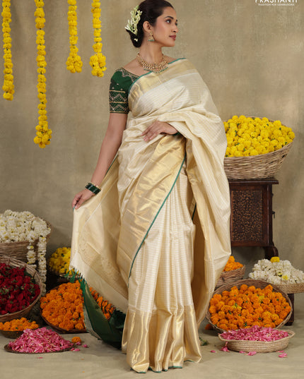 Cream-Green Pure kanchipuram silk saree with silver & gold zari woven stripes pattern and long zari woven border