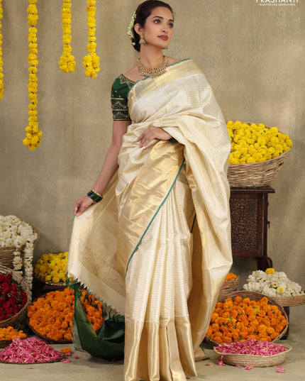 Cream-Green Pure kanchipuram silk saree with silver & gold zari woven stripes pattern and long zari woven border