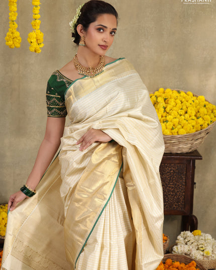 Cream-Green Pure kanchipuram silk saree with silver & gold zari woven stripes pattern and long zari woven border