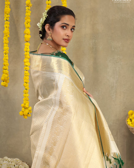 Cream-Green Pure kanchipuram silk saree with silver & gold zari woven stripes pattern and long zari woven border