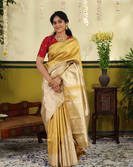 Gold Tissue kanchipuram silk saree with zari woven brocade weaves & rising temple border