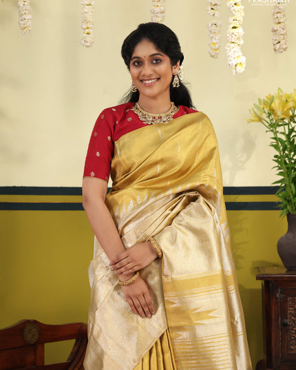 Gold Tissue kanchipuram silk saree with zari woven brocade weaves & rising temple border