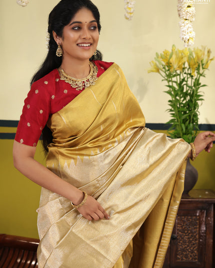 Gold Tissue kanchipuram silk saree with zari woven brocade weaves & rising temple border