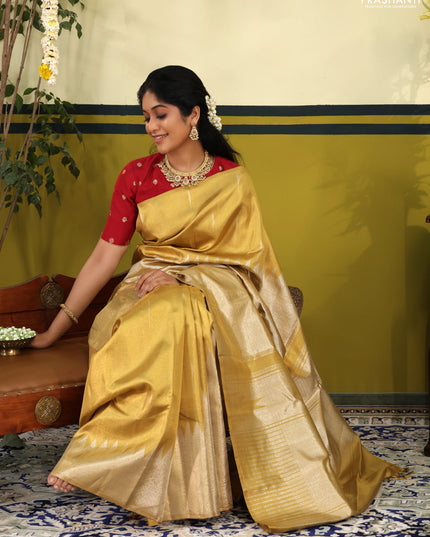 Gold Tissue kanchipuram silk saree with zari woven brocade weaves & rising temple border