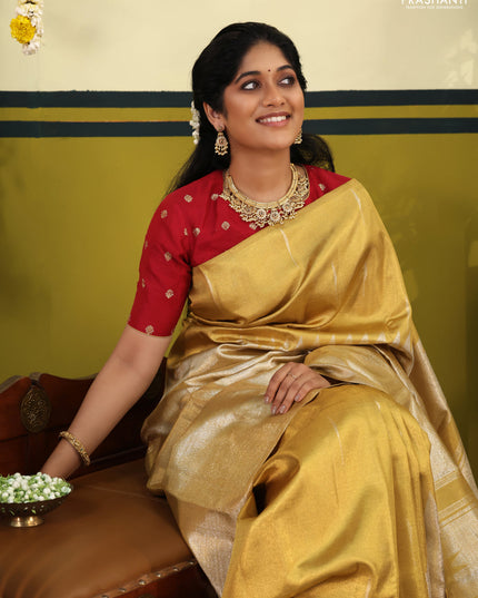 Gold Tissue kanchipuram silk saree with zari woven brocade weaves & rising temple border
