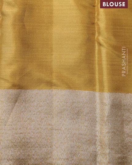 Gold Tissue kanchipuram silk saree with zari woven brocade weaves & rising temple border