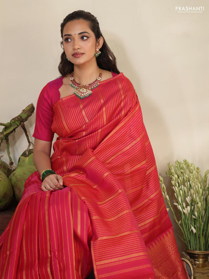 Pink pure kanchipuram silk saree with allover zari stripes pattern & in borderless style