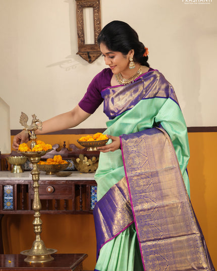 Teal-Blue Pure kanchipuram silk saree with Allover zari weaves and long rich zari border