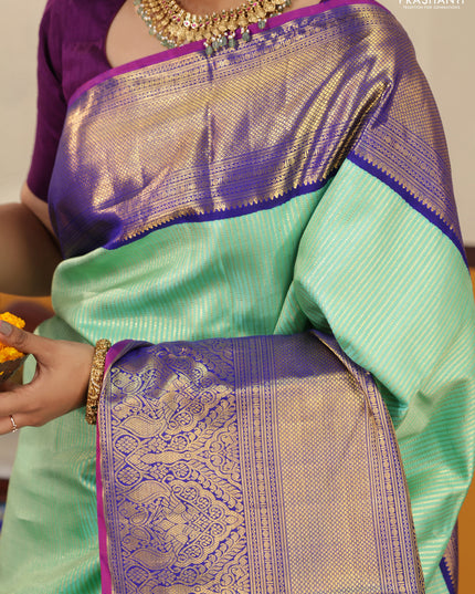 Teal-Blue Pure kanchipuram silk saree with Allover zari weaves and long rich zari border