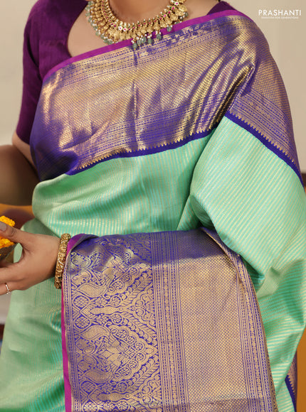 Teal-Blue Pure kanchipuram silk saree with Allover zari weaves and long rich zari border
