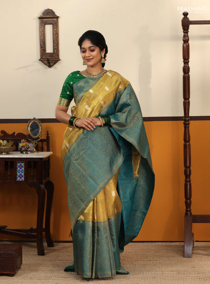Gold-Peacock blue Pure Tissue Kanchipuram Silk Saree With Silver zari buttas & Long rich zari border