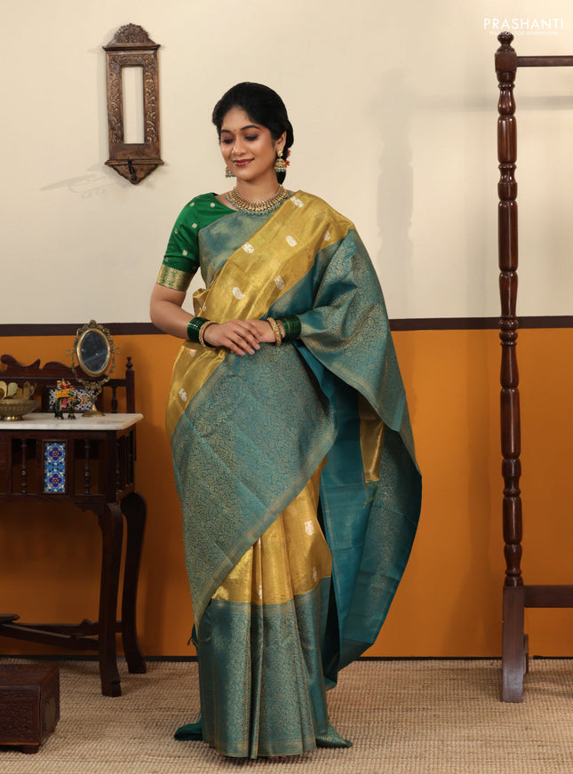 Gold-Peacock blue Pure Tissue Kanchipuram Silk Saree With Silver zari buttas & Long rich zari border