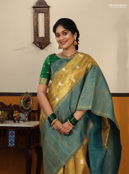 Gold-Peacock blue Pure Tissue Kanchipuram Silk Saree With Silver zari buttas & Long rich zari border
