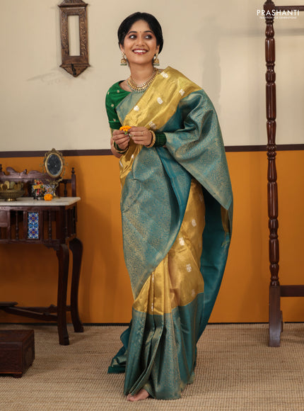 Gold-Peacock blue Pure Tissue Kanchipuram Silk Saree With Silver zari buttas & Long rich zari border