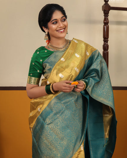 Gold-Peacock Green Pure Tissue Kanchipuram Silk Saree With Silver zari buttas & Long rich zari border