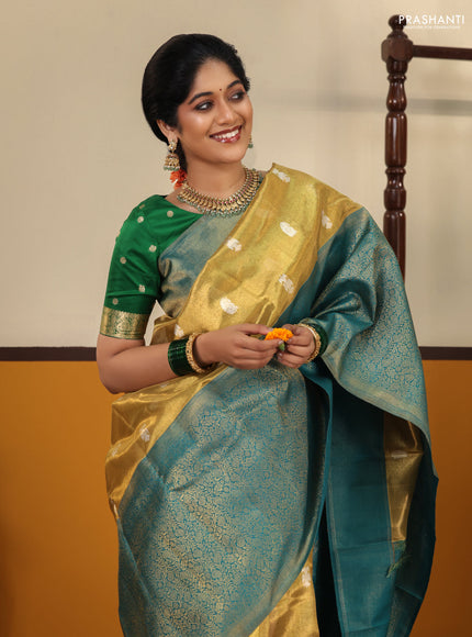 Gold-Peacock blue Pure Tissue Kanchipuram Silk Saree With Silver zari buttas & Long rich zari border