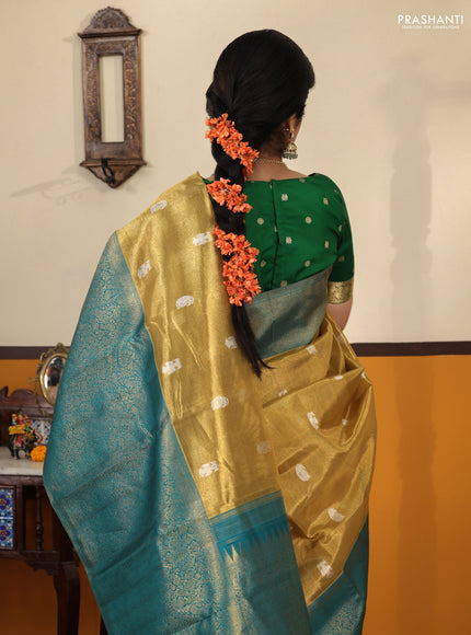 Gold-Peacock blue Pure Tissue Kanchipuram Silk Saree With Silver zari buttas & Long rich zari border