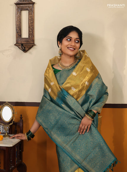 Gold-Peacock blue Pure Tissue Kanchipuram Silk Saree With Silver zari buttas & Long rich zari border