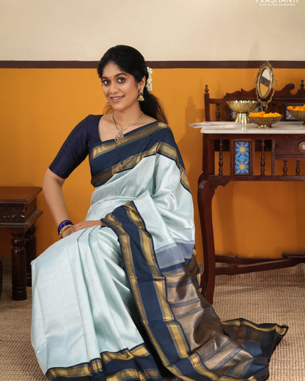Pastel blue-Navy blue Pure Kanchipuram Silk Saree With allover zari woven brocade weaves and Reattapet zari woven border