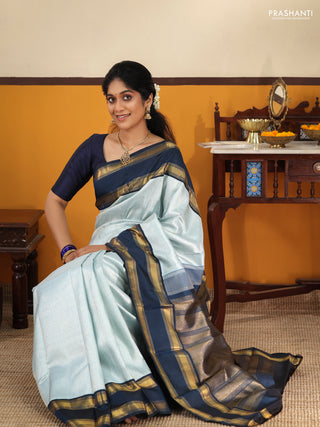 Pastel blue-Navy blue Pure Kanchipuram Silk Saree With allover zari woven brocade weaves and Reattapet zari woven border