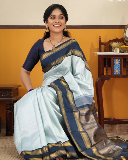 Pastel blue-Navy blue Pure Kanchipuram Silk Saree With allover zari woven brocade weaves and Reattapet zari woven border