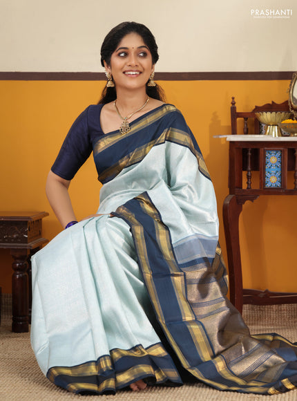 Pastel blue-Navy blue Pure Kanchipuram Silk Saree With allover zari woven brocade weaves and Reattapet zari woven border