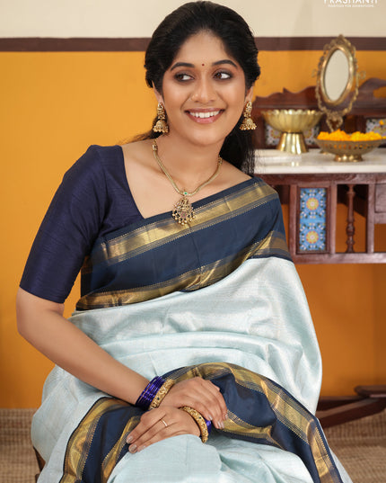 Pastel blue-Navy blue Pure Kanchipuram Silk Saree With allover zari woven brocade weaves and Reattapet zari woven border