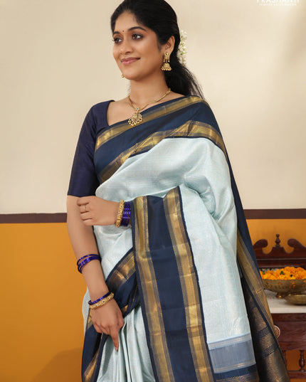 Pastel blue-Navy blue Pure Kanchipuram Silk Saree With allover zari woven brocade weaves and Reattapet zari woven border