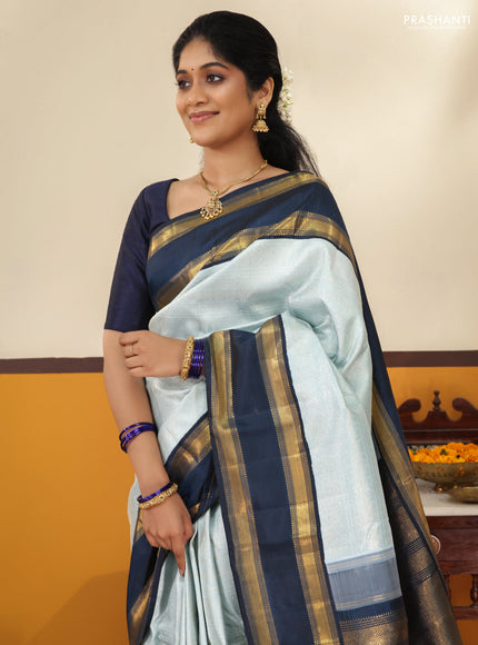 Pastel blue-Navy blue Pure Kanchipuram Silk Saree With allover zari woven brocade weaves and Reattapet zari woven border