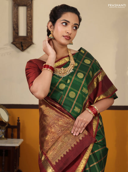 Green-Maroon Pure kanchipuram Silk Saree With Allover zari checks & buttas and rettapet zari woven border