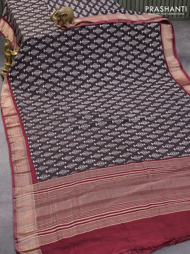 Semi gadwal saree black and maroon with allover ikat butta weaves and zari woven border