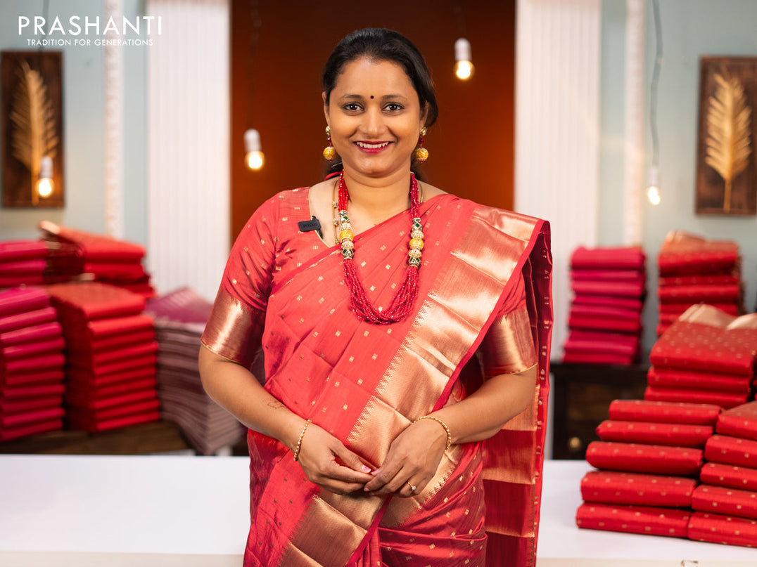Semi raw silk saree red shade with allover geometric zari woven buttas and zari woven border