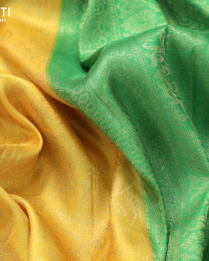 Banarasi softy silk saree yellow and green with allover silver zari woven brocade weaves and silver zari woven border