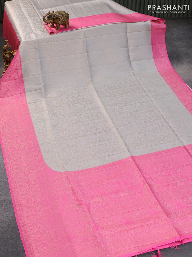 Banarasi softy silk saree pastel grey and light pink with allover silver zari woven brocade weaves and silver zari woven border