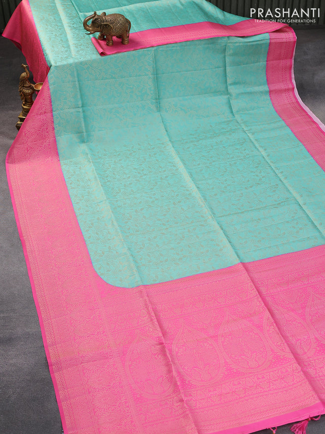 Banarasi softy silk saree teal blue and pink with allover silver zari woven brocade weaves and silver zari woven border