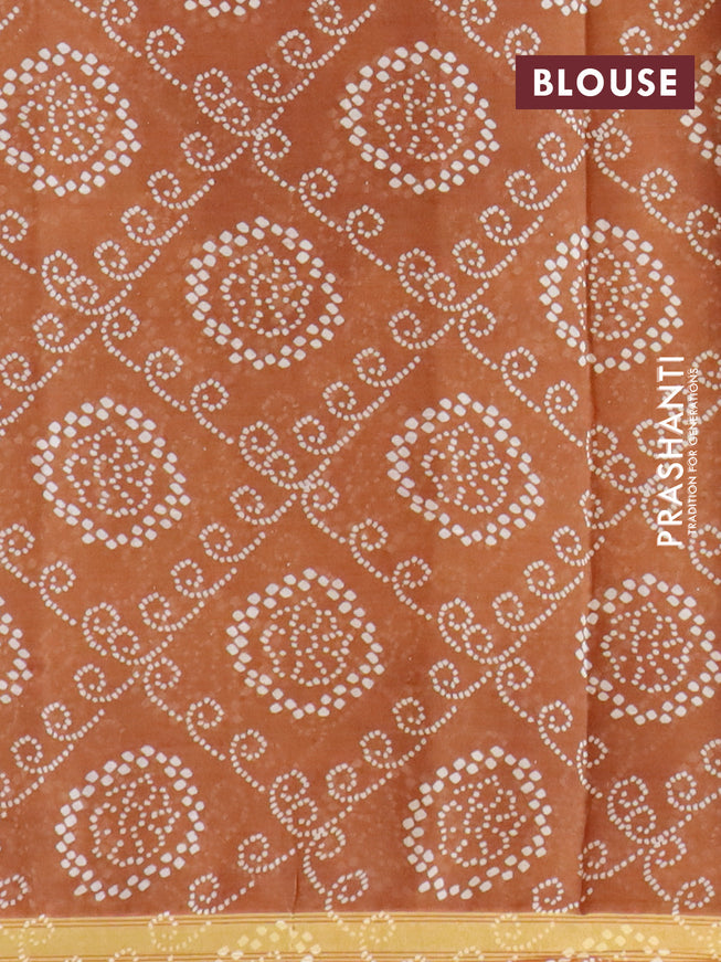 Mul cotton saree mustard shade with allover ajrakh prints and small zari woven border