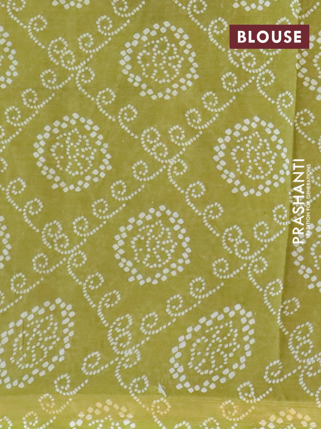 Mul cotton saree green and mehendi green with allover ajrakh prints and small zari woven border
