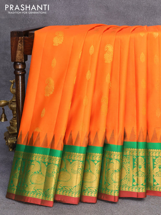 Pure gadwal silk saree orange and green with zari woven buttas and temple design zari woven border