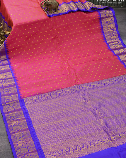 Pure gadwal silk saree dual shade of pinkish orange and blue with zari woven buttas and temple design floral zari woven border