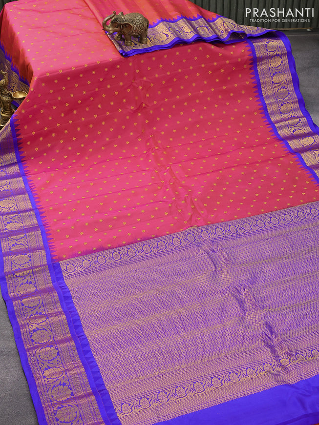 Pure gadwal silk saree dual shade of pinkish orange and blue with zari woven buttas and temple design floral zari woven border