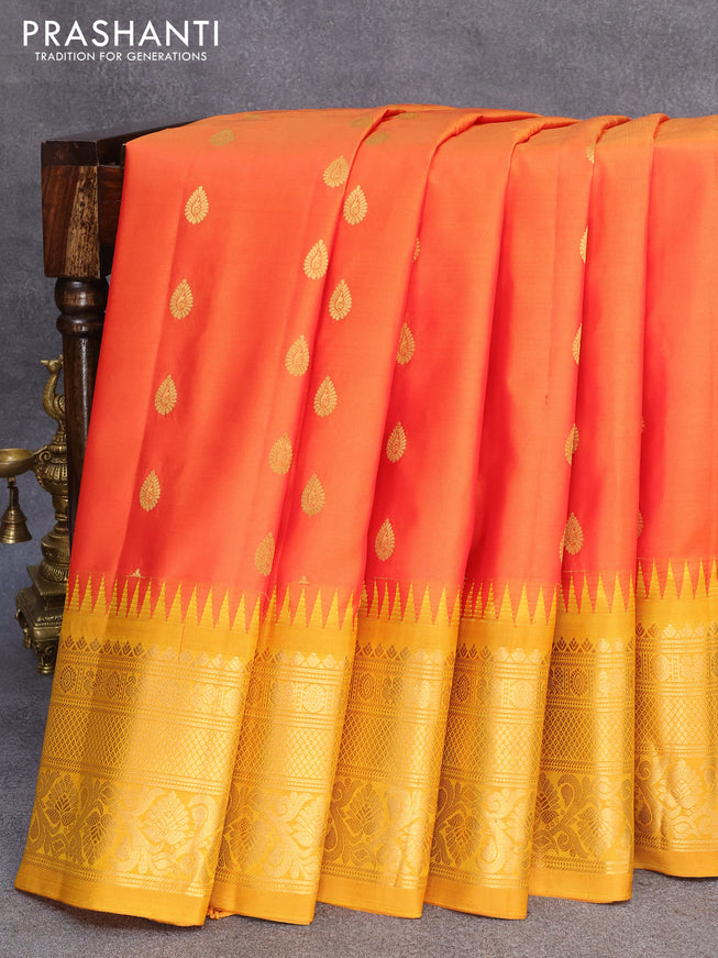 Pure gadwal silk saree sunset orange and mustard yellow with zari woven buttas and temple design zari woven border