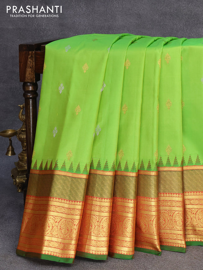 Pure gadwal silk saree light green and rust shade with zari woven buttas and temple design zari woven border