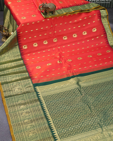 Pure gadwal silk saree orange and green with zari woven buttas and temple design long zari woven border
