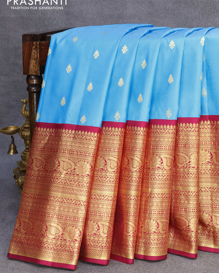Pure gadwal silk saree light blue and dark magenta pink with zari woven buttas and zari woven border