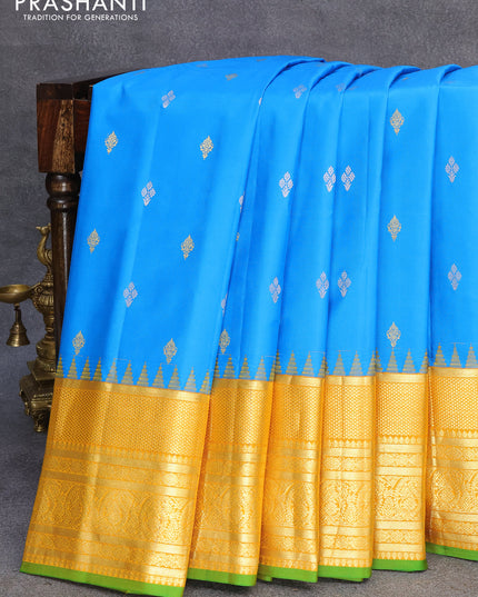 Pure gadwal silk saree cs blue and yellow with zari woven buttas and long zari woven border
