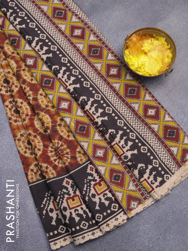 Kalamkari cotton saree sunset orange and black with allover batik prints and printed border