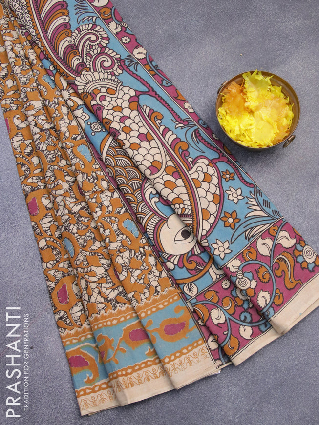 Kalamkari cotton saree mustard yellow and blue shade with allover batik prints and printed border