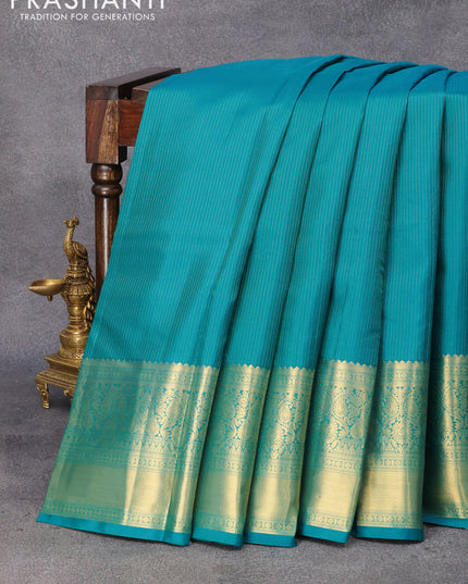 Pure kanjivaram silk saree teal blue and purple with allover zari weaves and long zari woven border & Allover wevaes