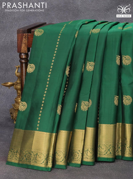 Pure kanjivaram silk saree green and dual shade of pinkish orange with annam zari woven buttas and zari woven border & Butta style